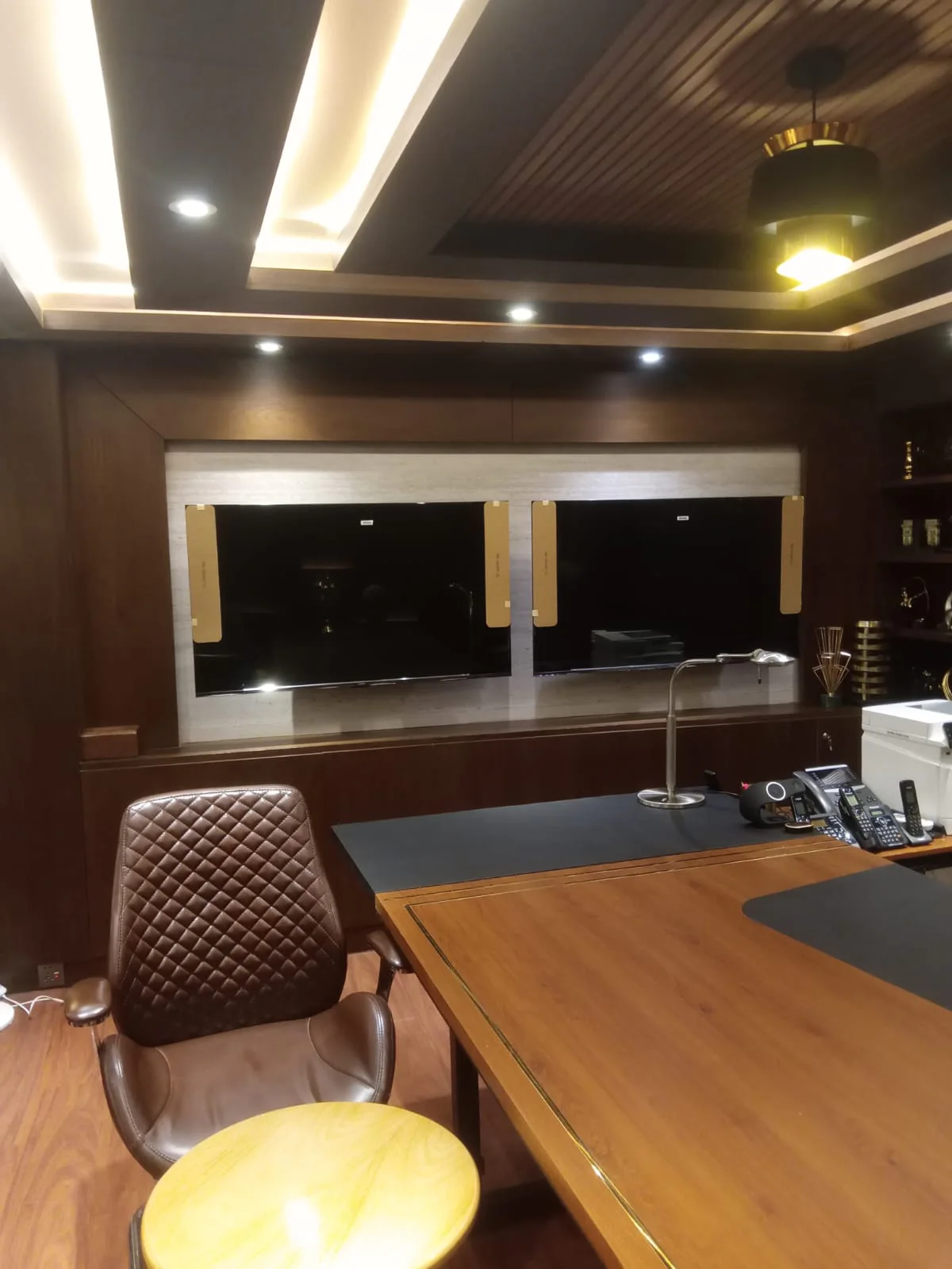 Executive office interior with custom wall panelling and joinery
