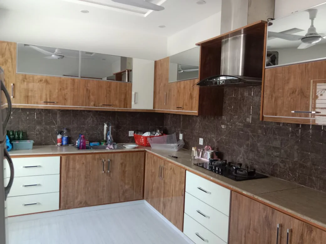 Modern L-shaped kitchen with custom cabinets
