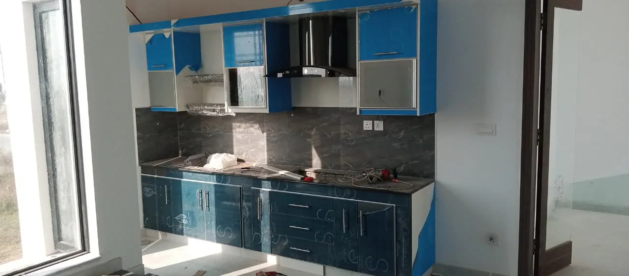 Modern L-shaped kitchen with custom cabinets